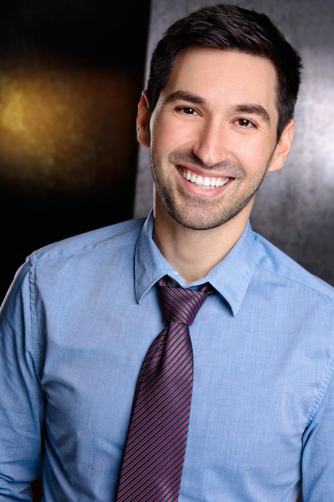 Eric Alfio in a blue shirt and tie